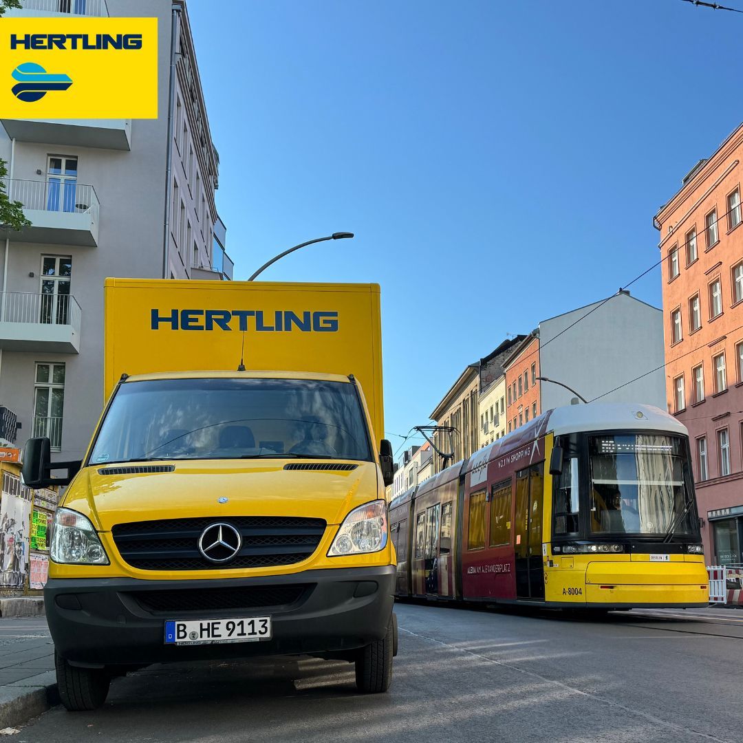 Hertling trucks next to a Berlin tram